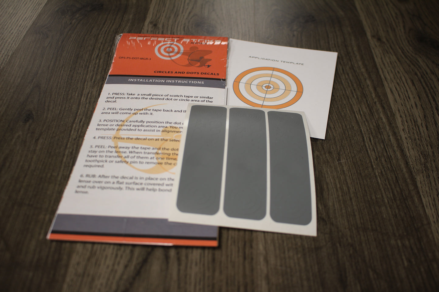 Perfect Strike Archery Circles and Dots Decals for Scope Lenses. Great for practice or competition. Adhesive backed vinyl decals. (Matte Grey)